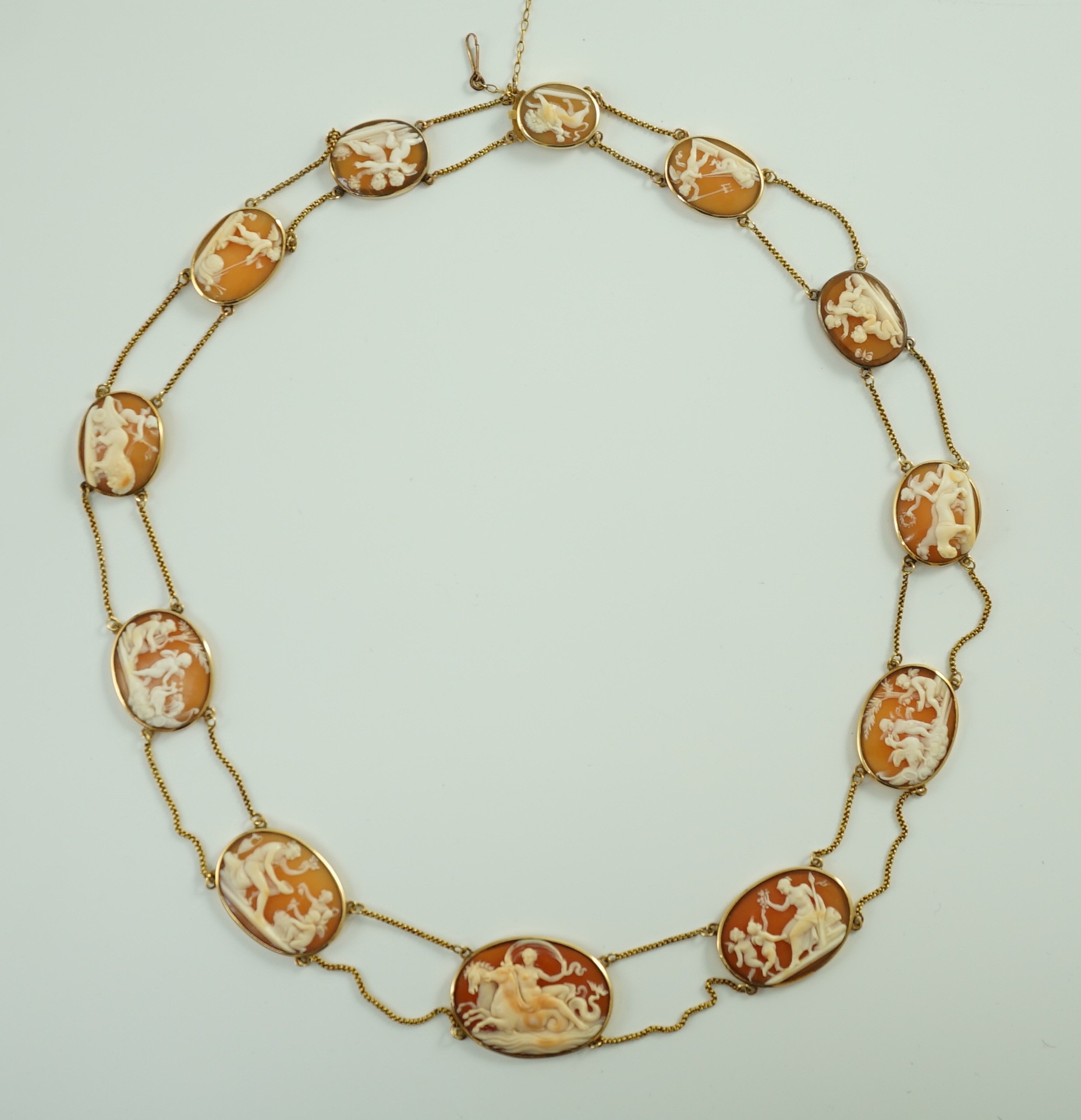 A late Victorian gold and graduated oval cameo shell necklace